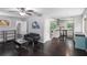 Open concept living room with hardwood floors, neutral paint, and a view into the kitchen at 3946 Flakes Mill Rd, Decatur, GA 30034