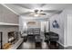 Bright living room with dark hardwood floors, a brick fireplace, and modern furnishings at 3946 Flakes Mill Rd, Decatur, GA 30034