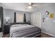 Cozy bedroom featuring two windows, neutral colors, and a closet for storage at 3946 Flakes Mill Rd, Decatur, GA 30034