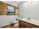 Bathroom features wood-look floors, vanity with solid surface top and wood shuttered window at 5545 Durrett Dr, Atlanta, GA 30338
