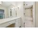 Bright bathroom with floral wallpaper featuring a vanity and a bathtub at 5545 Durrett Dr, Atlanta, GA 30338
