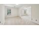 Neutral bedroom featuring natural light from shuttered windows and access to another room at 5545 Durrett Dr, Atlanta, GA 30338