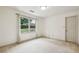 Comfortable bedroom with neutral carpet and a large window with natural light at 5545 Durrett Dr, Atlanta, GA 30338