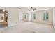 Bright bedroom with neutral walls and carpet features natural light and plantation shutters at 5545 Durrett Dr, Atlanta, GA 30338