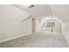 This spacious bonus room has neutral walls and carpet, plus a dormer window at 5545 Durrett Dr, Atlanta, GA 30338