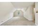 This carpeted bonus room features dormer windows and neutral walls at 5545 Durrett Dr, Atlanta, GA 30338