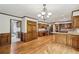 Kitchen and eating area, featuring wood paneling, cabinets, hardwood floors and stainless appliances at 5545 Durrett Dr, Atlanta, GA 30338