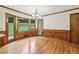 Bright kitchen features wood paneling, hardwood floors and views to the backyard at 5545 Durrett Dr, Atlanta, GA 30338