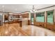 Bright kitchen features wood paneling, hardwood floors and views to the backyard at 5545 Durrett Dr, Atlanta, GA 30338