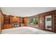 Living room with hardwood floors, built in bookcases, fireplace, and several windows overlooking backyard at 5545 Durrett Dr, Atlanta, GA 30338