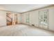 Spacious living room with classic trim, natural light, and neutral carpet at 5545 Durrett Dr, Atlanta, GA 30338