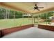 Relax on this screened porch overlooking a lush lawn and manicured landscape at 5545 Durrett Dr, Atlanta, GA 30338