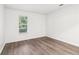 Well-lit bedroom with a window and gray wood-look flooring at 1931 Brian Way, Decatur, GA 30033