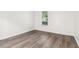Well-lit bedroom with a window and gray wood-look flooring at 1931 Brian Way, Decatur, GA 30033