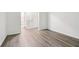 Bedroom leading to the bathroom with grey wood flooring at 1931 Brian Way, Decatur, GA 30033