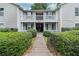 Apartment building entrance with well-kept landscaping and an inviting walkway at 1931 Brian Way, Decatur, GA 30033