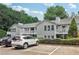 Apartment complex featuring balconies, parking spaces, and mature trees at 1931 Brian Way, Decatur, GA 30033