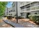 Exterior view of the apartment building with balconies and well-maintained landscaping at 1931 Brian Way, Decatur, GA 30033