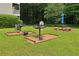Outdoor grilling area featuring built-in grills, picnic tables, and shaded seating at 1931 Brian Way, Decatur, GA 30033