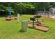 Outdoor grilling area with picnic tables and green grass, perfect for community gatherings at 1931 Brian Way, Decatur, GA 30033