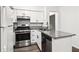 Kitchen featuring stainless steel appliances and stone countertops at 1931 Brian Way, Decatur, GA 30033