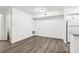Bright and open living room with grey wood flooring and fresh white paint at 1931 Brian Way, Decatur, GA 30033