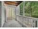Enclosed patio with sliding doors to interior and view of surrounding landscape at 1931 Brian Way, Decatur, GA 30033