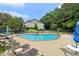 Relaxing outdoor pool area with lounge chairs and tables on a sunny day at 1931 Brian Way, Decatur, GA 30033