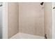 Shower with tiled walls and bronze shower head at 1931 Brian Way, Decatur, GA 30033