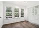 Bright sunroom featuring three windows and vertical blinds at 1931 Brian Way, Decatur, GA 30033