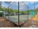Fenced tennis court with trees in the background at 1931 Brian Way, Decatur, GA 30033