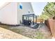 Home's backyard with a patio featuring a grill and a pergola at 327 Nobleman Way, Canton, GA 30114