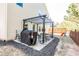 Backyard with patio featuring a grill, pergola, and fenced yard at 327 Nobleman Way, Canton, GA 30114