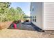 Home backyard features a patio, grill and a slide at 327 Nobleman Way, Canton, GA 30114