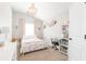 Charming bedroom with a chandelier, pink accents, and a playful design at 327 Nobleman Way, Canton, GA 30114
