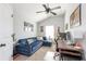 Versatile bedroom featuring a sectional sofa and a desk at 327 Nobleman Way, Canton, GA 30114