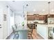 Open-concept kitchen and dining area with updated appliances and granite countertops at 327 Nobleman Way, Canton, GA 30114