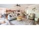 Spacious open-concept featuring a living room with an open kitchen and staircase at 327 Nobleman Way, Canton, GA 30114
