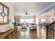 Open-concept living room with hardwood floors, lots of light, and comfortable furniture at 327 Nobleman Way, Canton, GA 30114