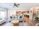 Open-concept featuring a living room with a partial view of the kitchen and staircase at 327 Nobleman Way, Canton, GA 30114