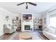 Elegant living room showcases fireplace, open shelving, and inviting decor at 327 Nobleman Way, Canton, GA 30114