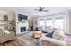 Bright living room features a fireplace, open shelving, and comfortable seating at 327 Nobleman Way, Canton, GA 30114