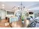 Open concept view of the kitchen, dining, and living room, offering a spacious and inviting atmosphere at 327 Nobleman Way, Canton, GA 30114