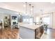 Open concept view of the kitchen, dining, and living room, offering a spacious and inviting atmosphere at 327 Nobleman Way, Canton, GA 30114