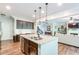 Open concept view of the kitchen and living room, offering a spacious and inviting atmosphere at 327 Nobleman Way, Canton, GA 30114