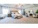 Spacious main bedroom with a tray ceiling, a sitting area, and plenty of natural light at 327 Nobleman Way, Canton, GA 30114