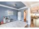Cozy playroom area with white trim, blue walls, unique chandelier, and an open layout at 327 Nobleman Way, Canton, GA 30114