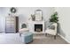 Charming sitting area with accent chairs, decorative fireplace, and stylish decor at 327 Nobleman Way, Canton, GA 30114