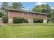 Expansive backyard featuring a lush green lawn and mature trees, ideal for outdoor enjoyment at 4125 Lindsey Dr, Decatur, GA 30035