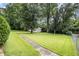 Well-maintained lawn with mature trees and foliage at 4125 Lindsey Dr, Decatur, GA 30035